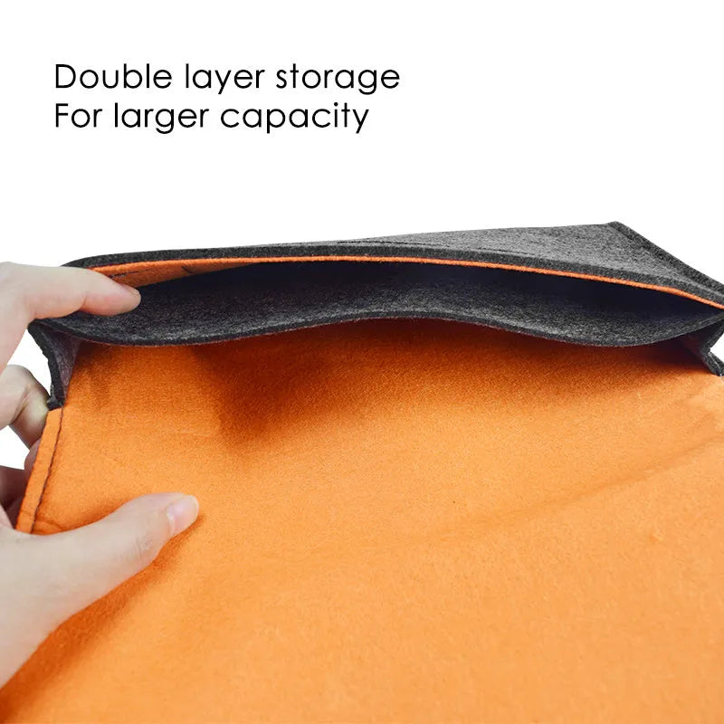 Black felt protective pouch for Nintendo Switch console showing game card slots and double layer design