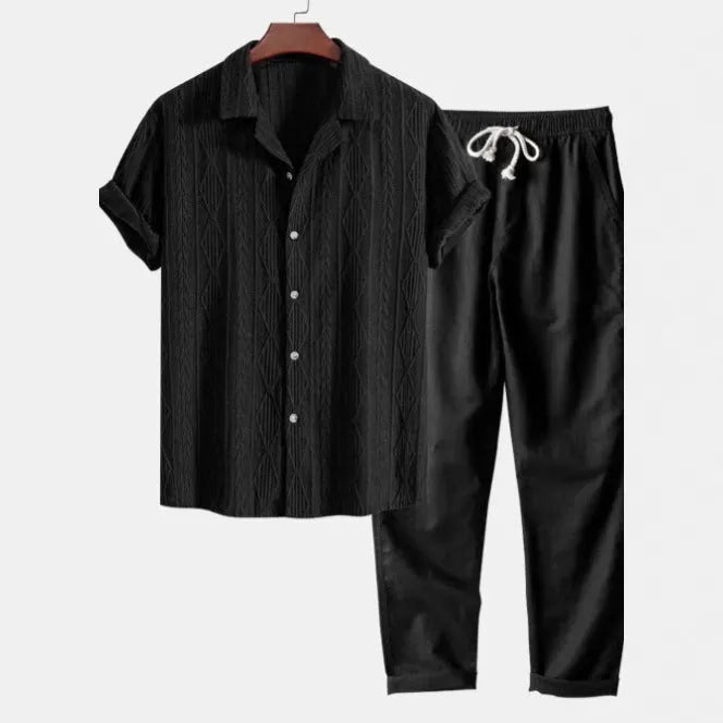 Men's slim fit camouflage print casual suit with short sleeve shirt and trousers on a hanger.