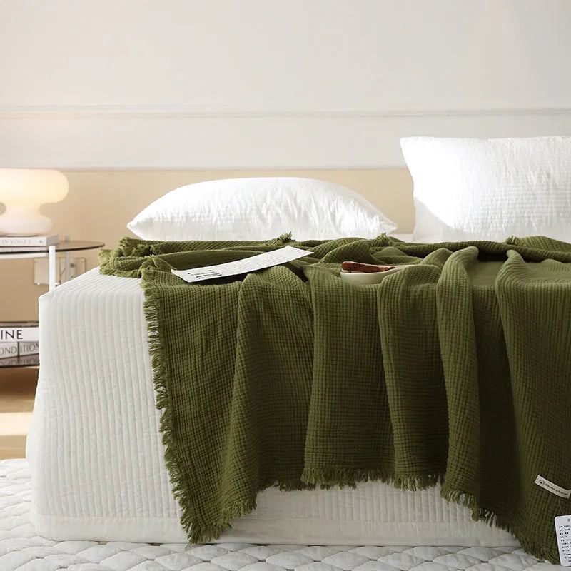 Four-layer cotton gauze blanket with tassel edge in a choice of ten colours.