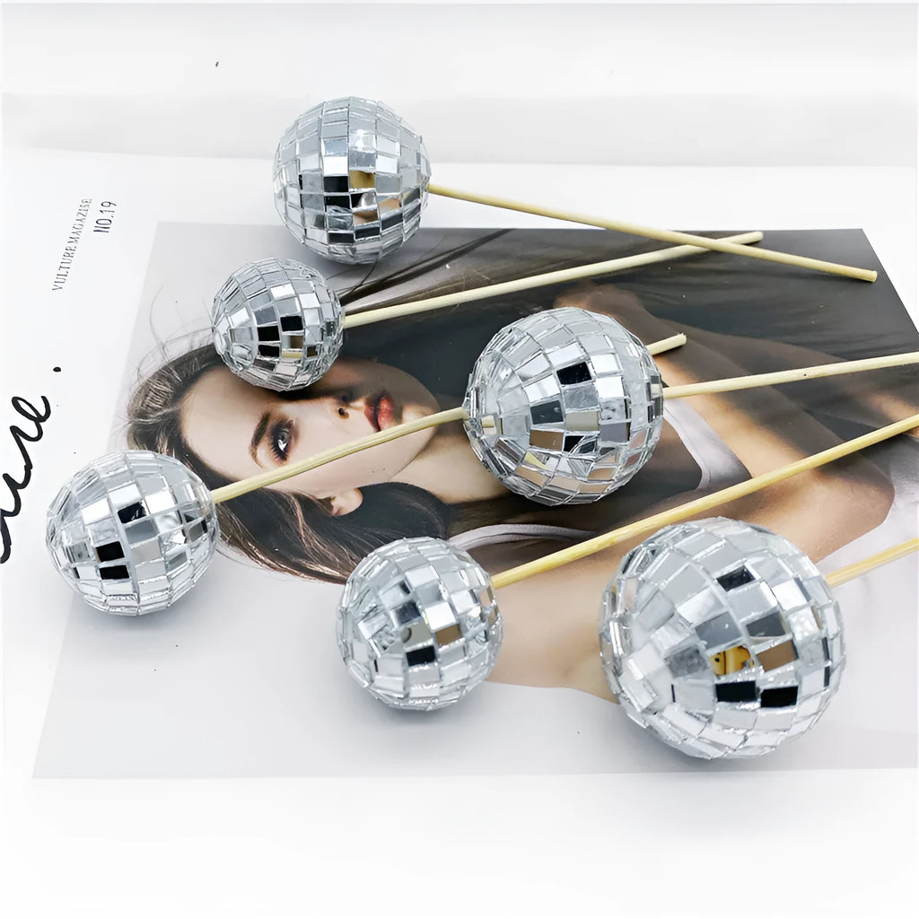 Glass mirror ball cake decoration on a wooden stick, available in four different sizes.