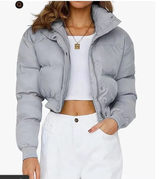 Women's loose fit long sleeve polyester jacket in blue colour on a hanger