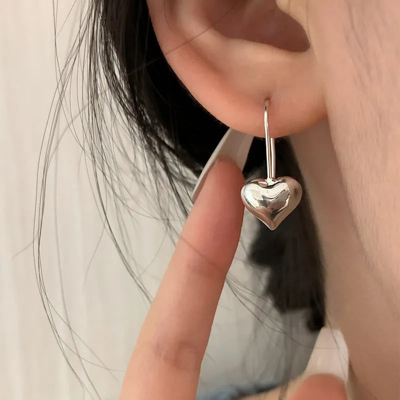 Women's silver heart-shaped earrings with glossy three-dimensional Korean-style design