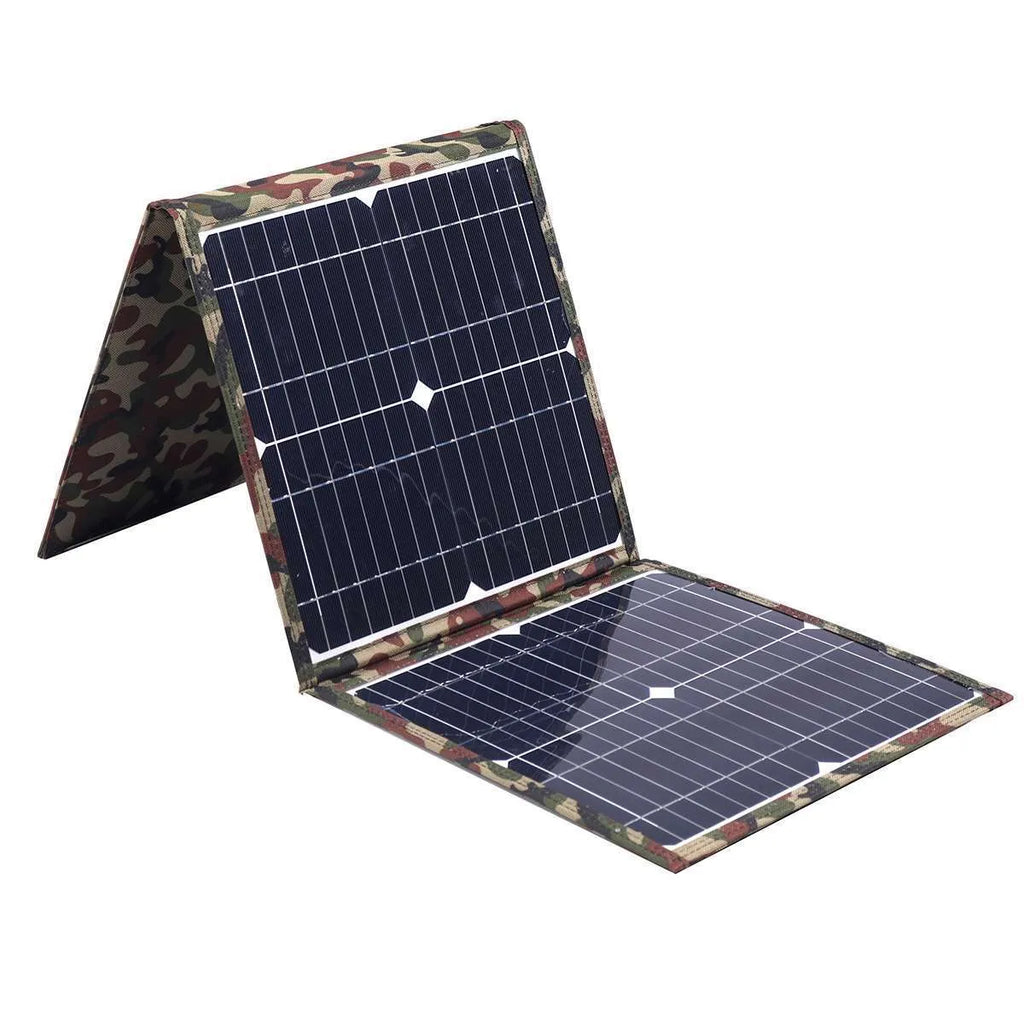 Black foldable 36W solar panel unfolded showing three monocrystalline silicon cells with car charger and USB accessories