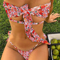 Women's lace-up split swimsuit with built-in chest pad in a floral print