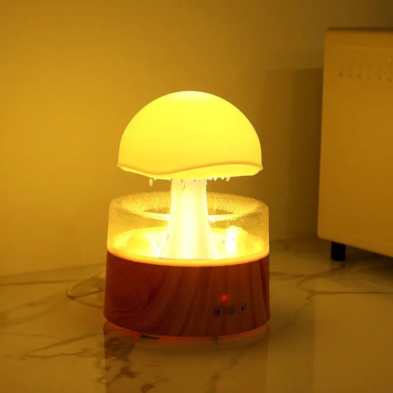 White rain cloud shaped humidifier and aroma diffuser with LED lighting and rainfall simulation