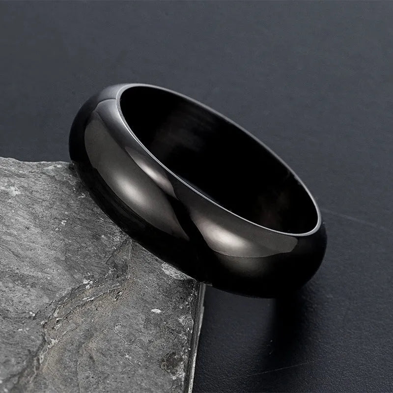 Glossy electroplated titanium steel ring in gold, black and steel colours showing detailed finish
