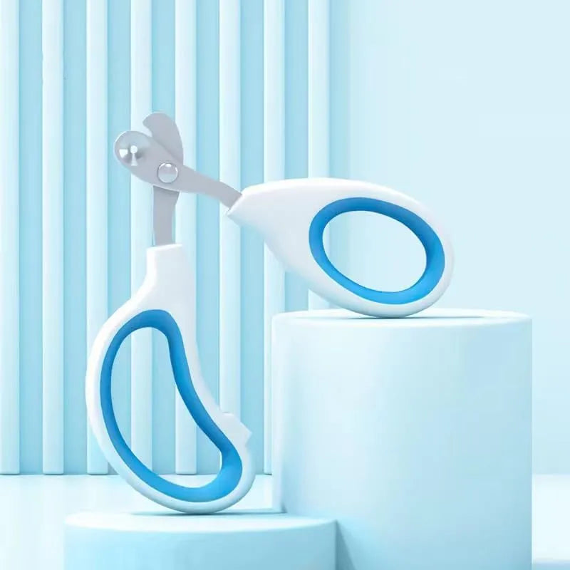 Blue cat nail clippers with circular cut hole and cushioned handle for safe pet nail trimming
