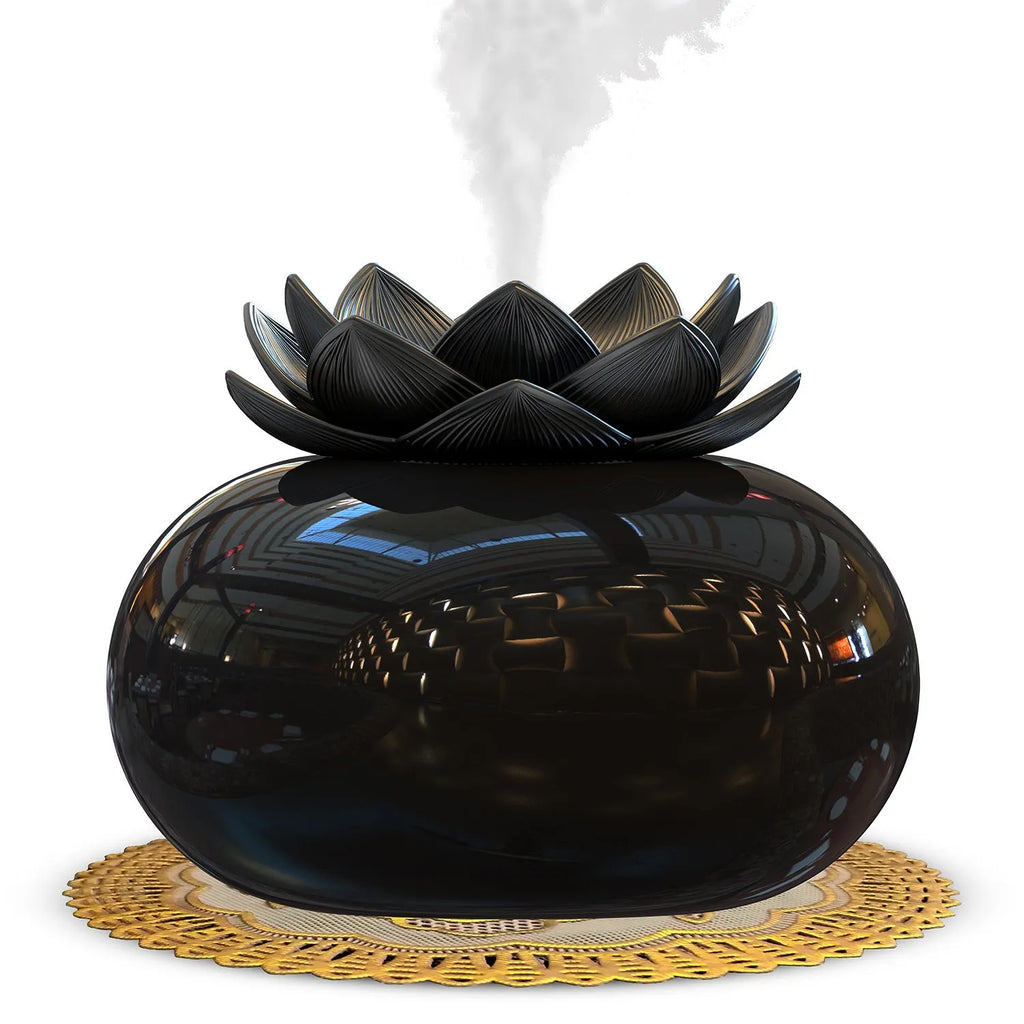 Pure black lotus aromatherapy humidifier with USB cable on desk surface