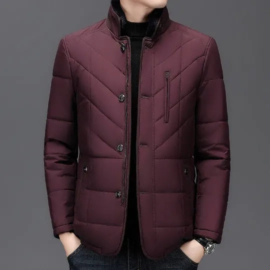Men's solid colour winter padded coat in dark blue, shown with side seam pockets.