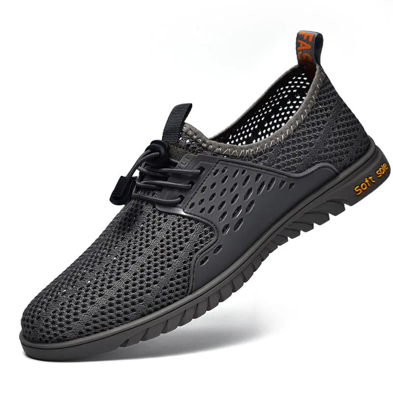 Men's black mesh casual shoes with elastic band and rubber sole on a white background