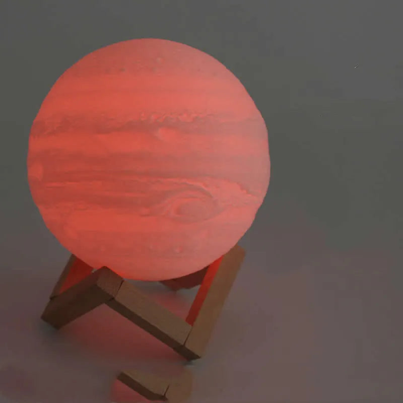 3D printed moon lamp with lunar surface detail on wooden stand, showing touch metal ring at base
