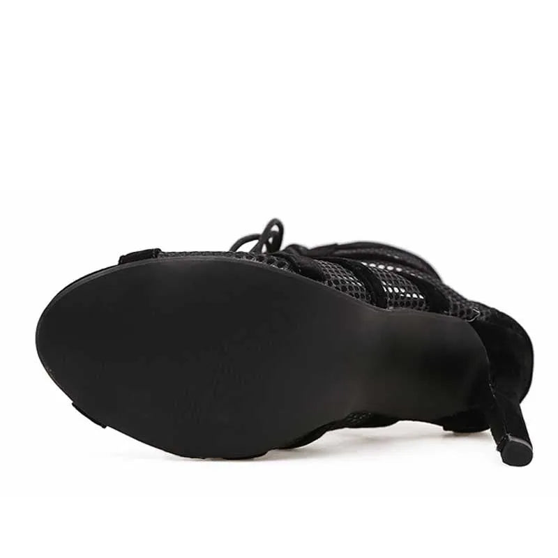 Black suede women's lace-up high heel shoes with 11.5cm heel on a plain background