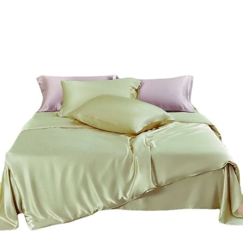 Solid colour silk duvet cover shown in Lotus Pink, double-sided design on a bed