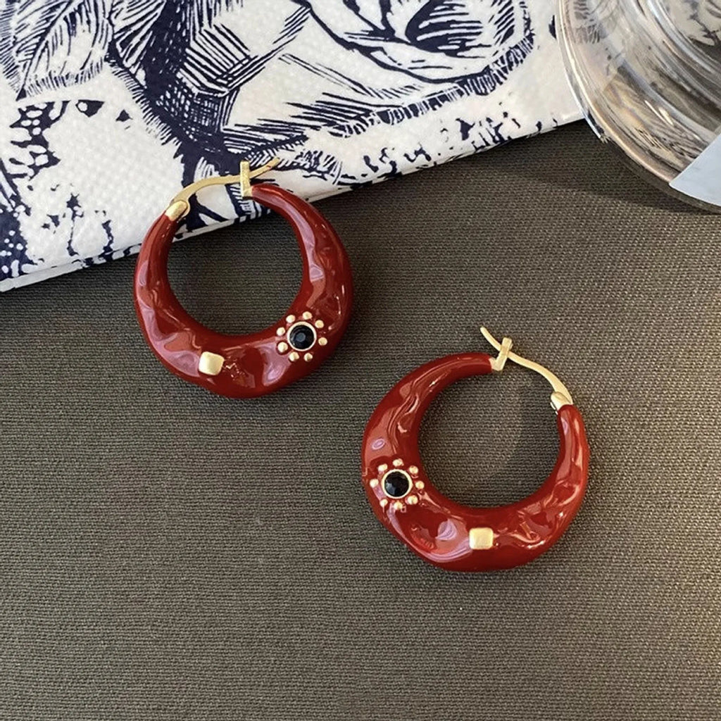 Retro Hong Kong style ear studs with rhinestone inlay and dripping oil textured finish in black and red colours