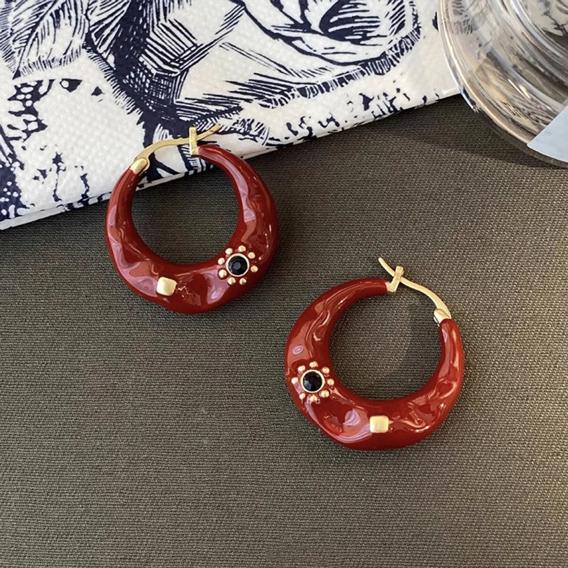 Retro Hong Kong style ear studs with rhinestone inlay and dripping oil textured finish in black and red colours