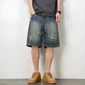 Men's blue denim shorts with retro loose hole distressing and a straight-leg cut.