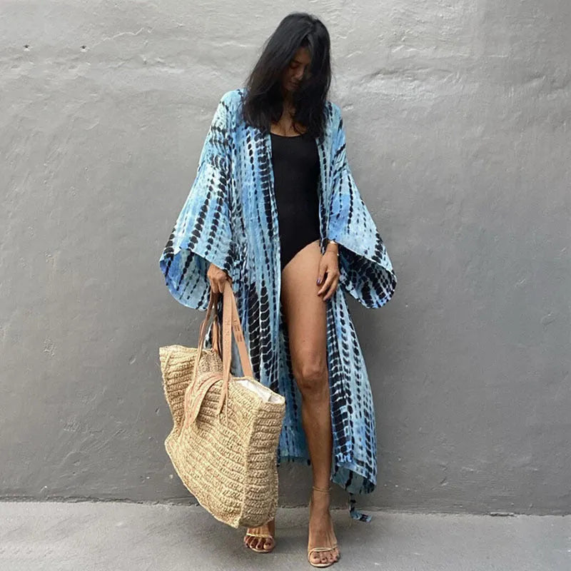 Women's printed loose-fit cotton beach cover-up shirt in rust red, open over a bikini.