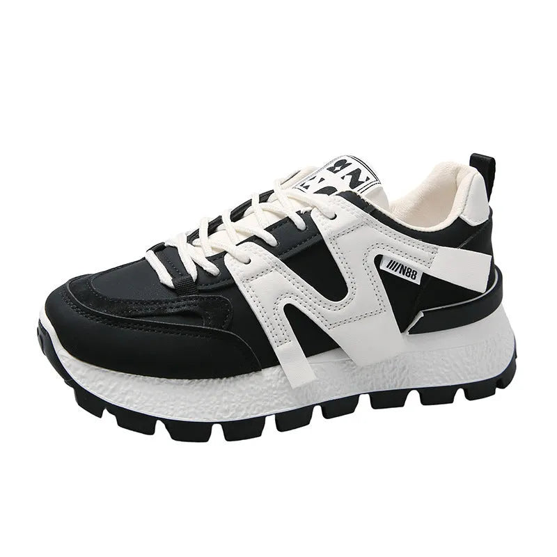 Artificial PU low top running sneakers in white and black colours with front lace-up design