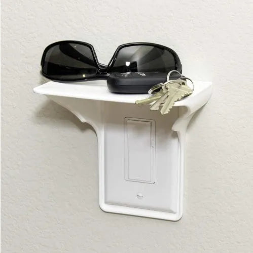 White plastic socket organiser rack for holding 1/4 inch and 1/2 inch drive tools.