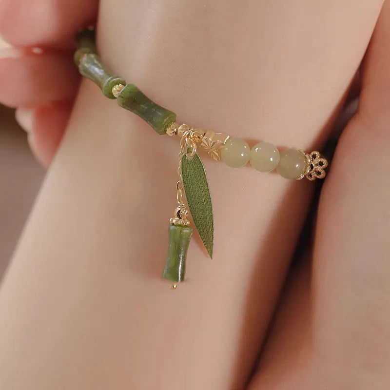A Chinese style glass bead bracelet for women featuring bamboo joint design elements.