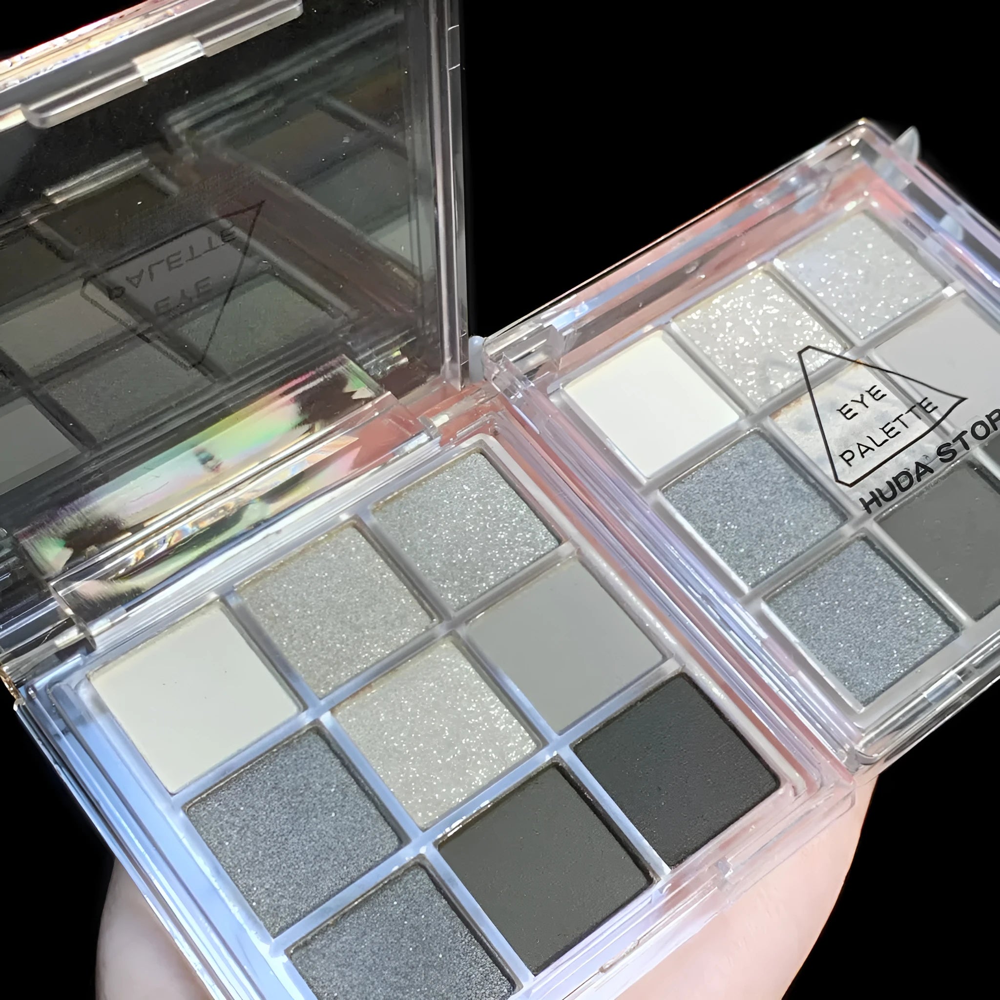 Nine-colour smoked theme eyeshadow palette showing white, silver, black, and iron grey shades