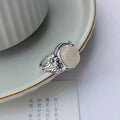 Adjustable copper vintage ring with U-shaped design and white chalcedony aesthetic