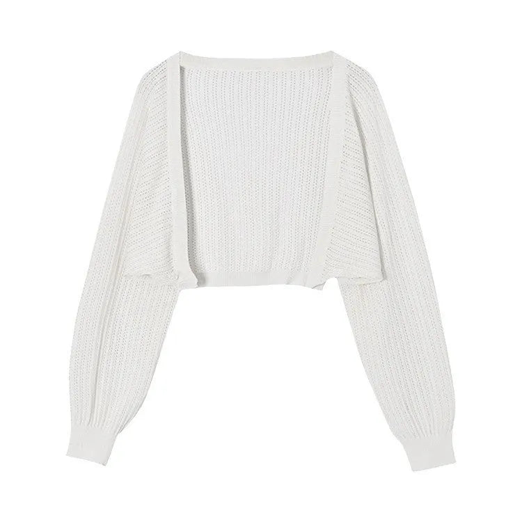 Thin polyester blouse with long hollow lantern sleeves in apricot colour, slim fit.
