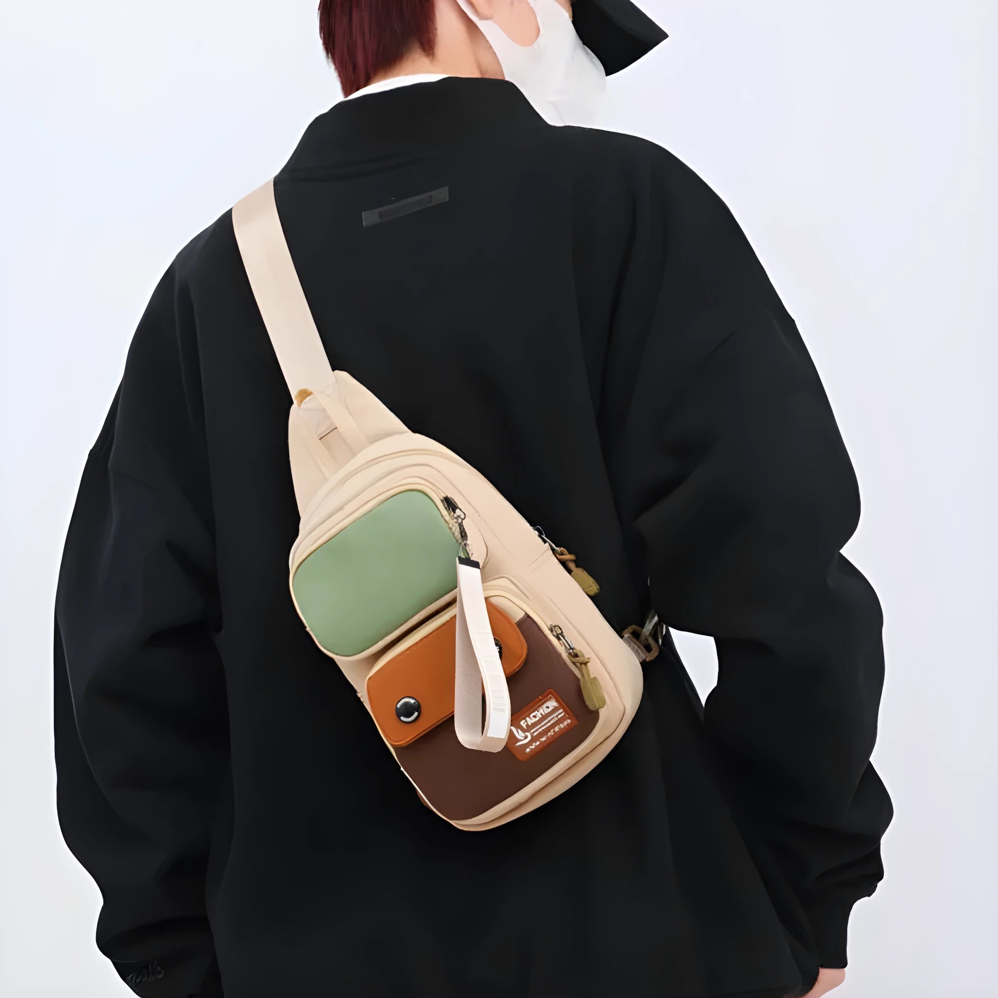 Nylon crossbody shoulder bag in black with contrast colour detailing and letter pattern