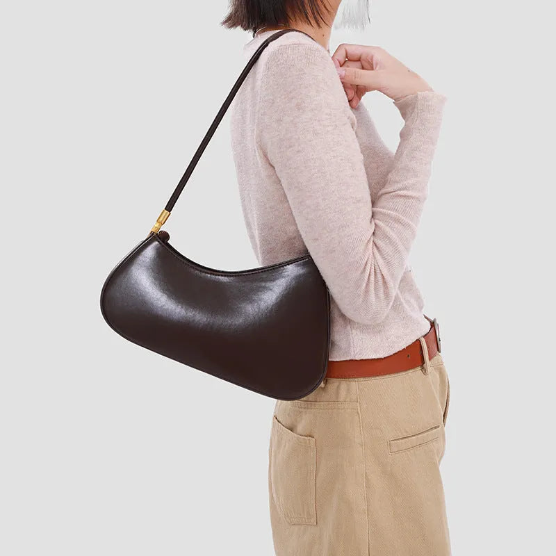 Women's oval PU leather underarm bag in multiple colours with single shoulder strap and zippered interior pouch
