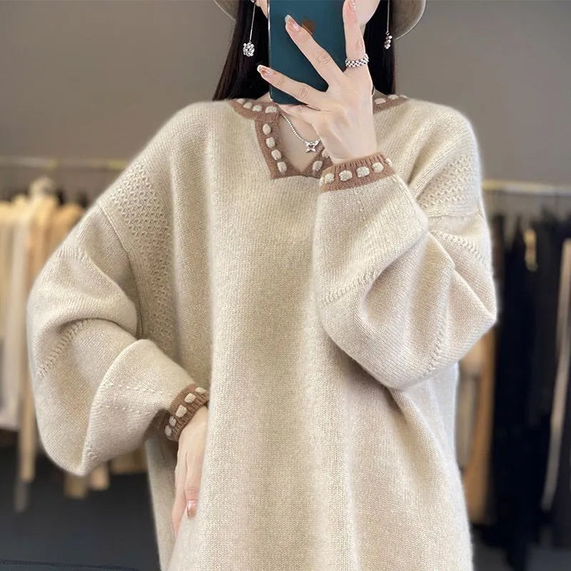 Women's camel coloured V-neck long sleeve viscose sweater laid flat.