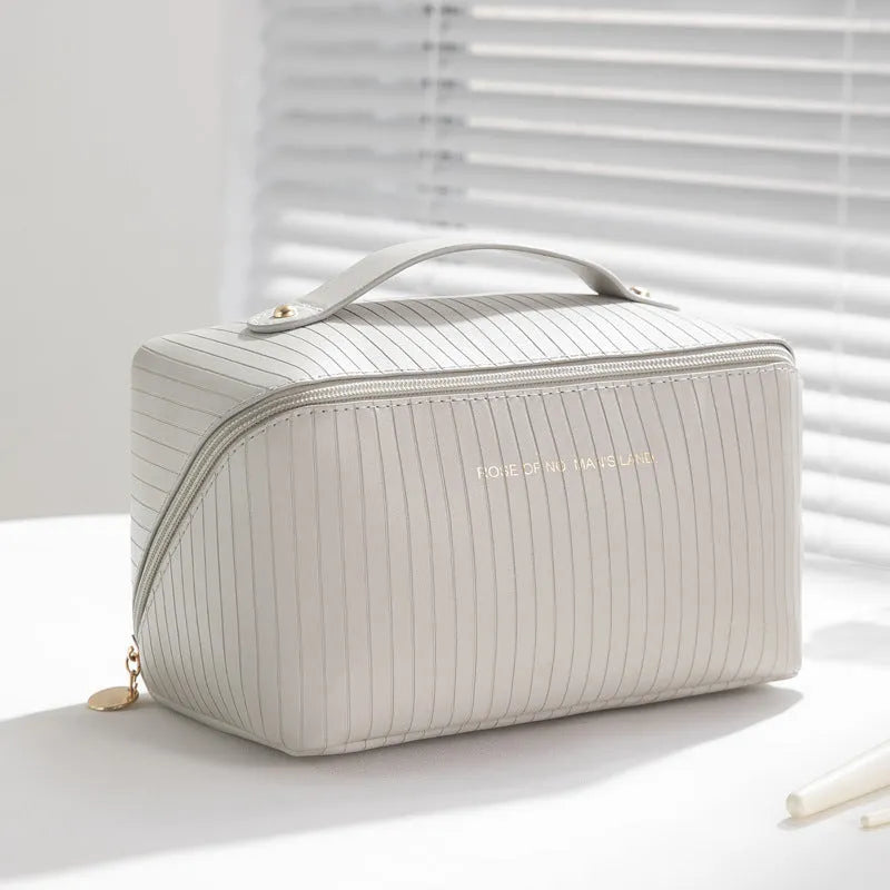 Vertical pattern pillow makeup bag showing cubic 22.5cm design with travel storage capacity