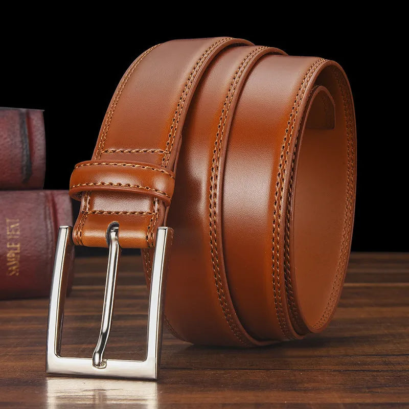 Men's black leather belt with a silver alloy pin buckle on a white background