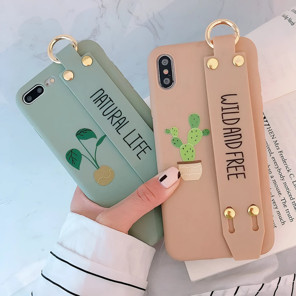 Green graffiti-style iPhone case with an integrated wristband holder on the back.