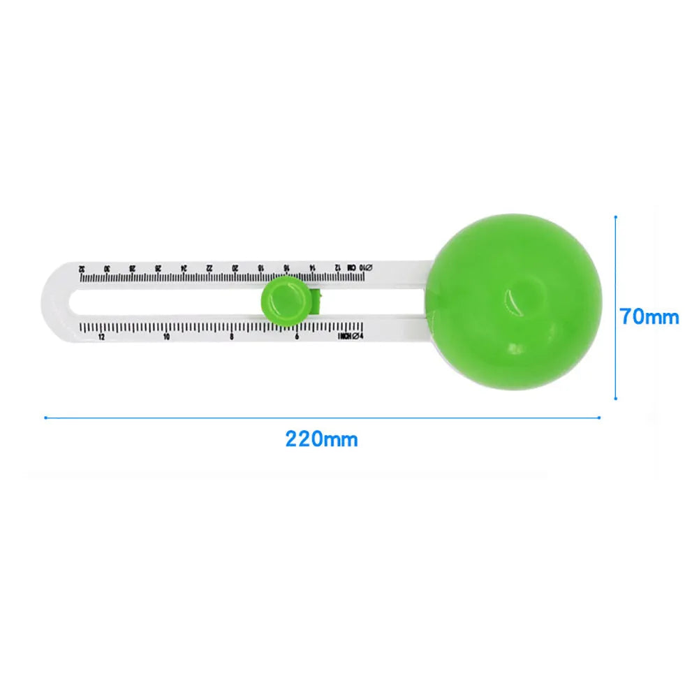 Orange or green plastic round paper cutter for A3 sheets on a colour box.