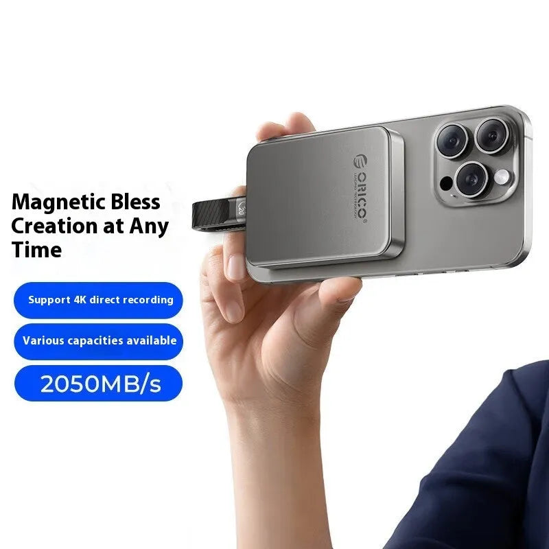 Grey ultra-thin magnetic mobile solid state drive with C to C cable and magnetic ring on packaging.