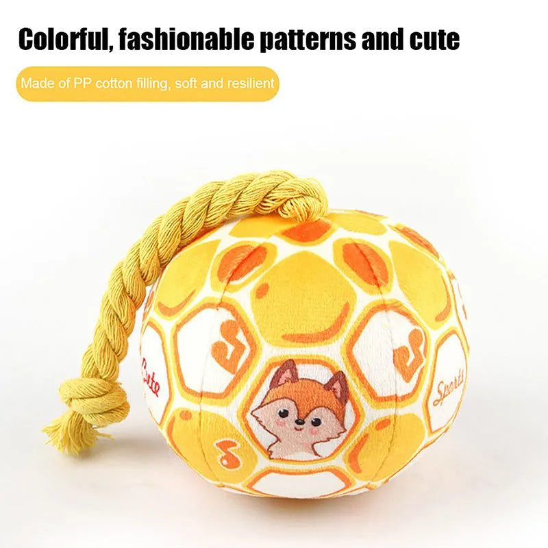 Blue and yellow elastic football dog tug toy with cotton rope construction for chewing and interactive play