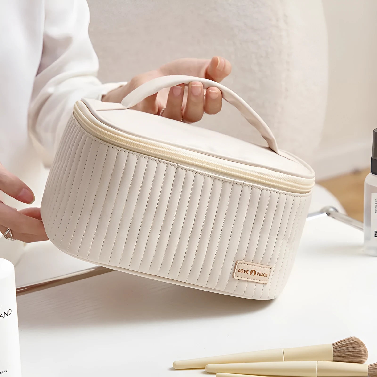Open-top PU leather makeup bag in beige colour showing wide-mouth design for easy access