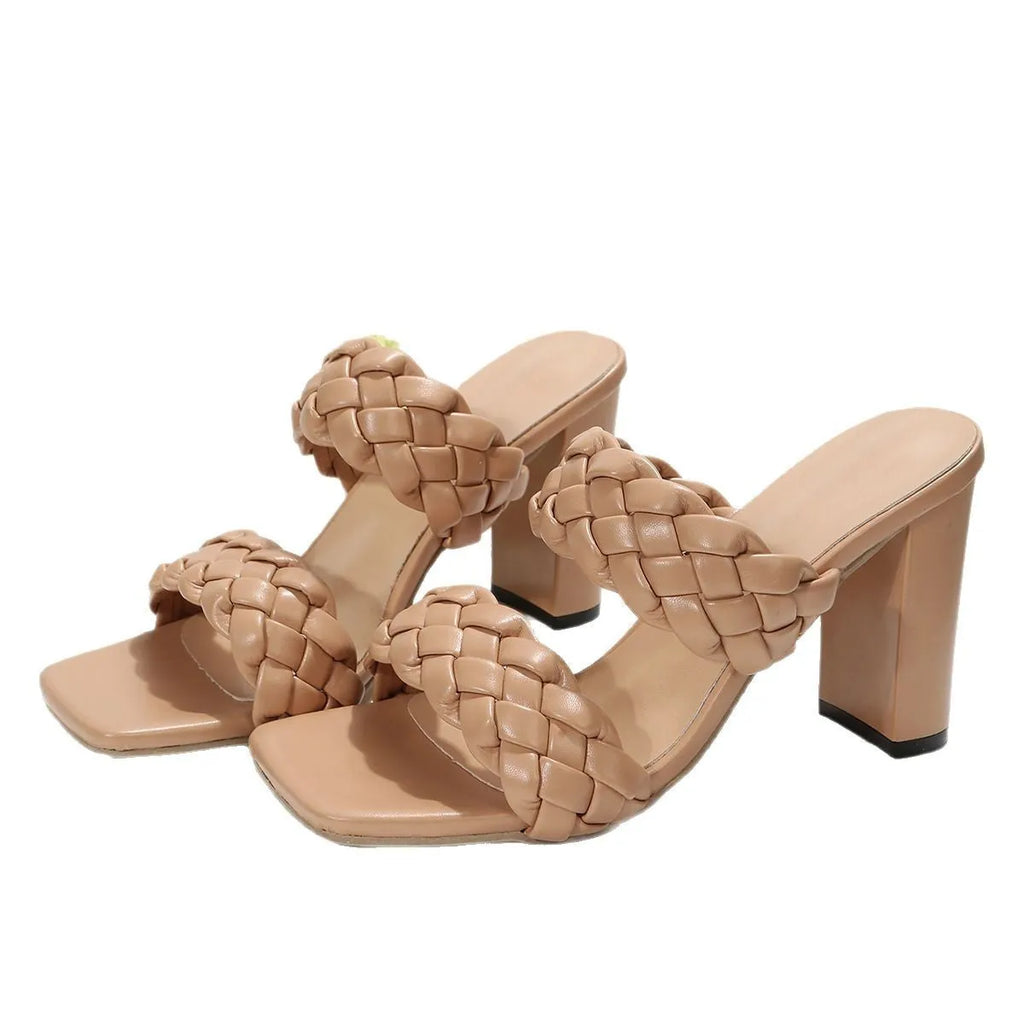 White square toe flip-flops with woven twisted detail and a chunky rubber heel.