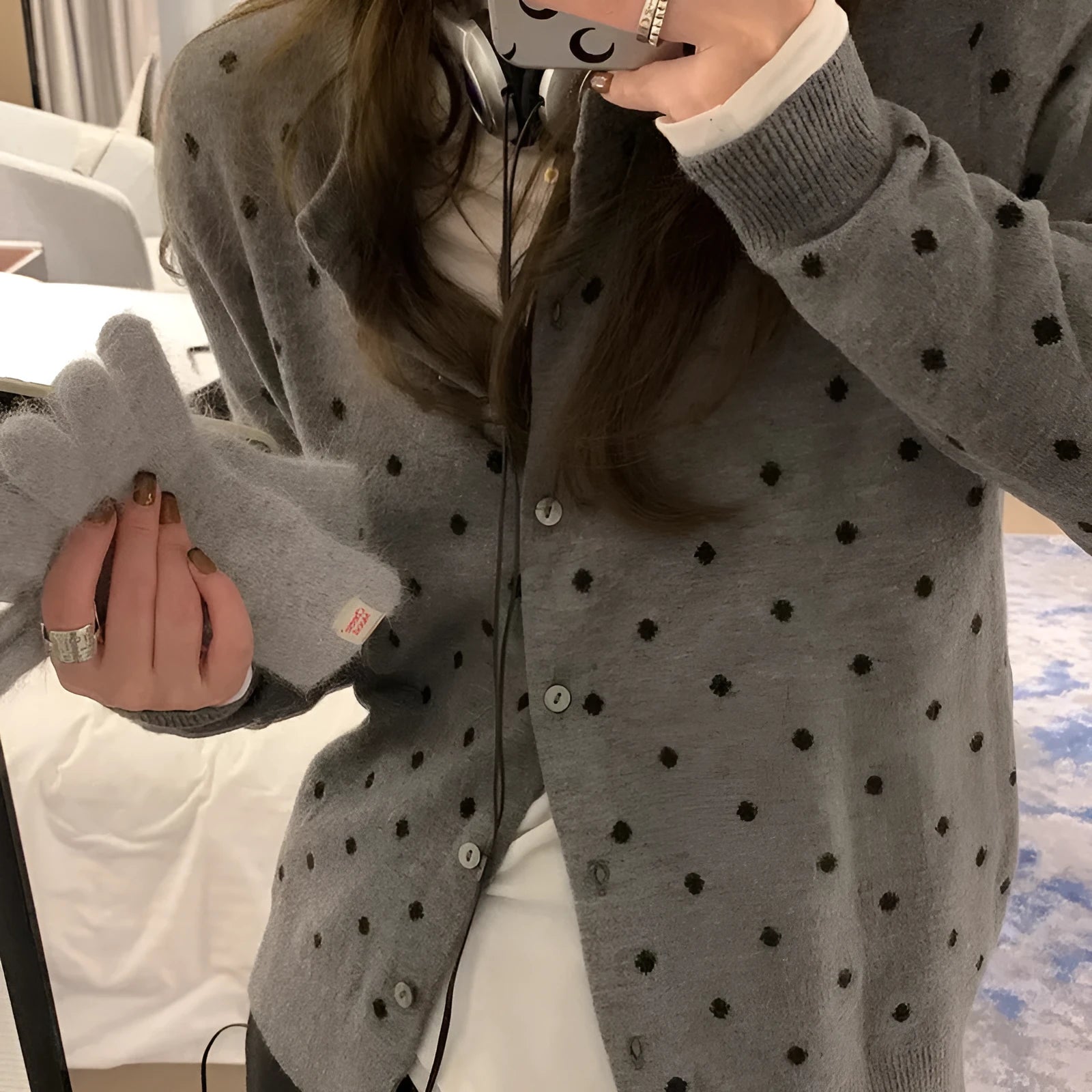 Women's gray dot knitted cardigan with crocheted flowers in black or gray.