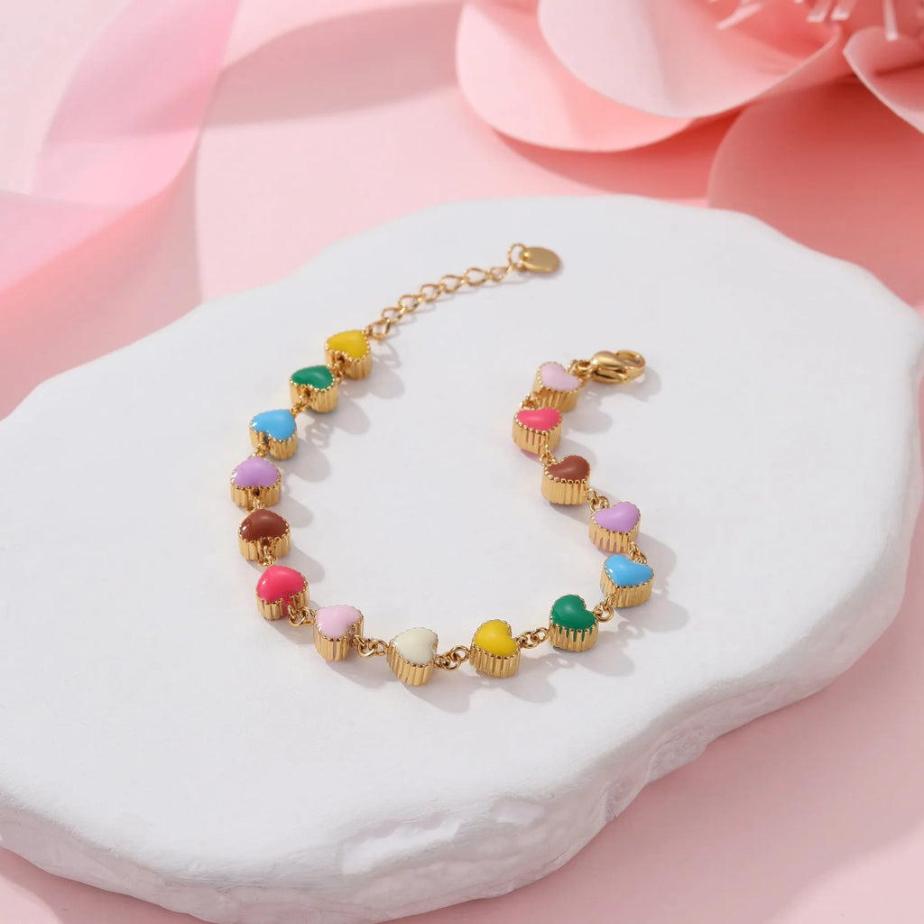 Gold plated women's bracelet with love heart pendant on titanium steel chain