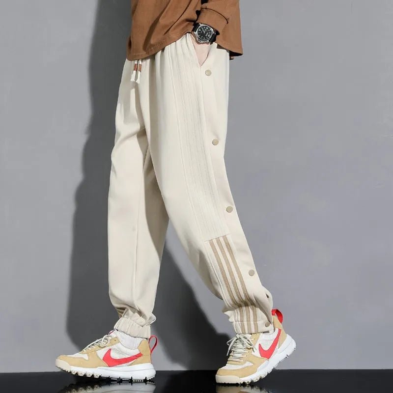 Men's black cotton blend sweatpants with high waist, belt, and adjustable ankle ties