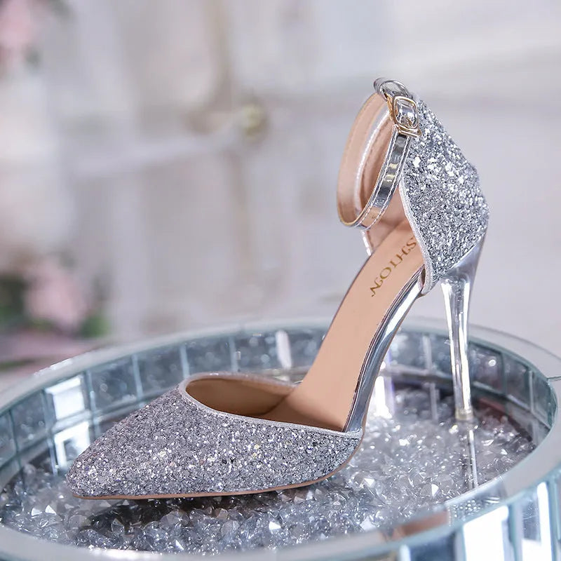 Gold and silver stiletto heel pumps with beaded and belt decoration on a solid-colour upper