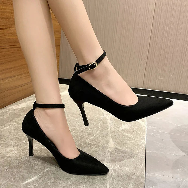 Women's black and white stiletto heel pump shoes with ankle buckle, showing 5cm and 8cm heel height options.