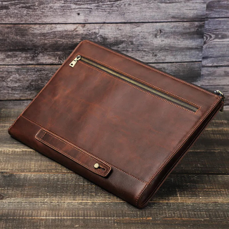 Crazy Horse oil leather zipper laptop bag in coffee colour on a wooden surface