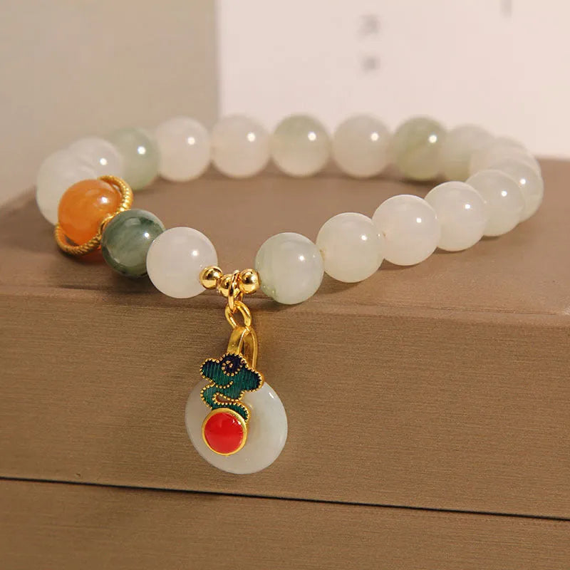 Women's ice jade bracelet with xiangyun peace pattern and pearl accents