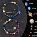 Two natural stone beaded bracelets with zodiac symbols on an elastic string.