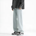 Men's light blue straight leg jeans with button front closure on mannequin