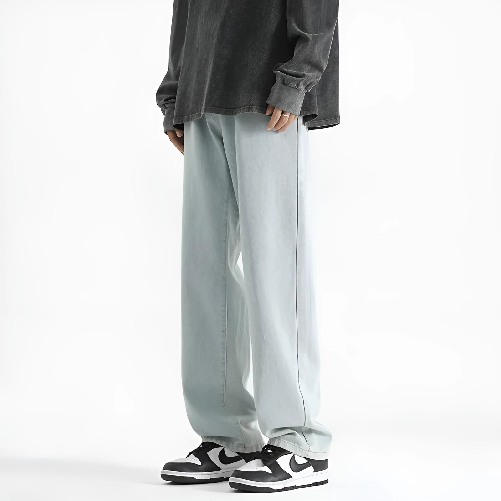 Men's light blue straight leg jeans with button front closure on mannequin