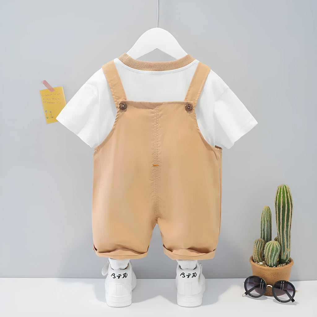 Yellow cotton baby summer overalls with cartoon design and openable straps on infant