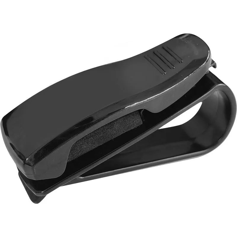 Black plastic multifunctional clip for car sun visor to hold sunglasses, tickets, and ID cards.